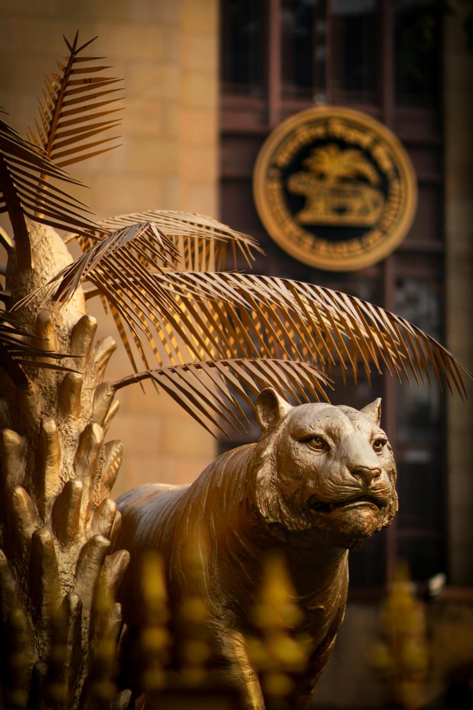 Bronze tiger statue in front of Reserve Bank of India, Mumbai, symbolizing strength and resilience.